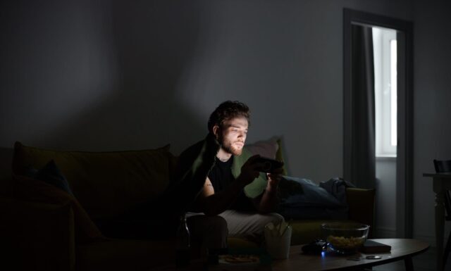 Unlocking the Excitement: Slot 88 Resmi and the Thrill of Online Gaming A Man Playing a Game using Smartphone