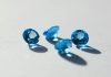 Blue Sapphire: A Stone of Beauty, Meaning, and Careful Choice blue stone on white surface
