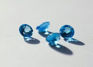 Blue Sapphire: A Stone of Beauty, Meaning, and Careful Choice blue stone on white surface