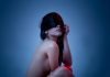 The Road To OnlyFans Fame: Biggest Challenges That Content Creators Face woman in red sleeveless dress