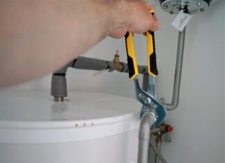 A Comprehensive Guide to Ball Valves and Float Valves: Essential Knowledge for DIY Enthusiasts person holding yellow and gray hand tool