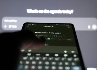 7 Simple AI Image Creation Tips Every Beginner Should Know Person typing on smartphone with ai chatbot on screen