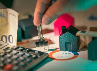 Stewardship in the Age of Algorithms: Using AI Wisely for Household Finances hand holding key over house models