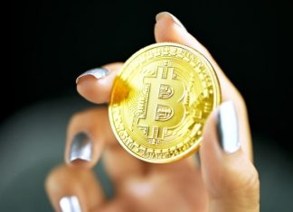 The Best Cryptocurrency Books to Read gold round coin on persons hand