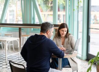 5 Tips for Succeeding as an Operations Manager man in black long sleeve shirt sitting on chair beside woman in black and white stripe