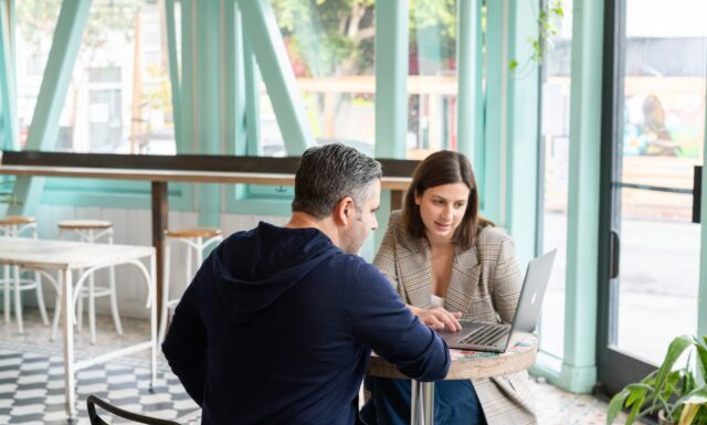 5 Tips for Succeeding as an Operations Manager man in black long sleeve shirt sitting on chair beside woman in black and white stripe