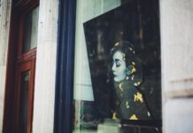 Style Queen: Audrey Hepburn’s 9 Favorite Things You’ll Be Perfect In a picture of a woman's face is seen through a window