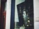 Style Queen: Audrey Hepburn’s 9 Favorite Things You’ll Be Perfect In a picture of a woman's face is seen through a window