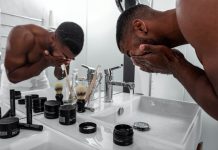 Even if they don’t want to believe it, men need skincare as well man standing in front of sink