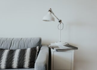 Is a full sofa sleeper useful? white desk lamp near gray fabric couch