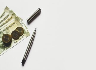 Refinancing’s Recent Boom, Explained gray pen beside coins on Indian rupee banknotes