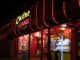 Mastering the Game: A Player’s Guide to Identifying Trustworthy Casinos a lit up store front at night with a lot of lights