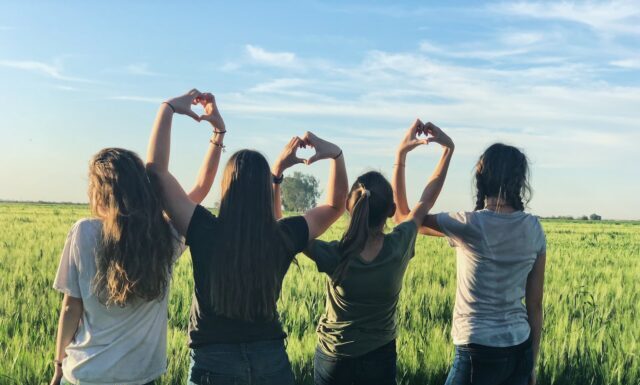 The Power of Peer Support: Building Connections for Teen Mental Health women forming heart gestures during daytime