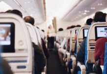 3 Reasons You Need a Travel Pillow shallow focus photography of people inside of passenger plane