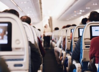 3 Reasons You Need a Travel Pillow shallow focus photography of people inside of passenger plane