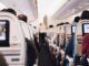 3 Reasons You Need a Travel Pillow shallow focus photography of people inside of passenger plane