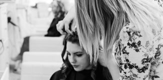 How to Choose the Best Professional for Long Haircuts: A Guide Based on Reviews and Ratings grayscale photography of woman getting her hair done inside salon