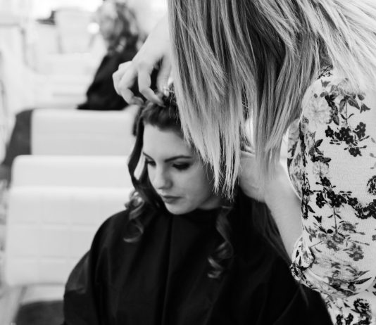 How to Choose the Best Professional for Long Haircuts: A Guide Based on Reviews and Ratings grayscale photography of woman getting her hair done inside salon