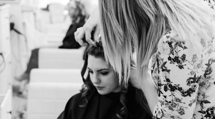 How to Choose the Best Professional for Long Haircuts: A Guide Based on Reviews and Ratings grayscale photography of woman getting her hair done inside salon