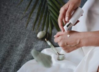 Turning Back the Clock With SNAP-8 person holding white plastic bottle pouring white liquid on white ceramic mug