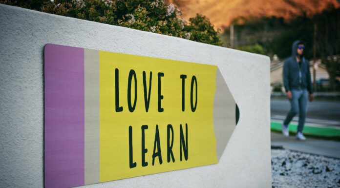 Stay Motivated when Learning a Language: 5 Tips love to learn pencil signage on wall near walking man