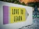 Stay Motivated when Learning a Language: 5 Tips love to learn pencil signage on wall near walking man
