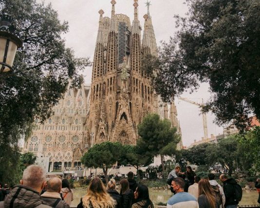 The Most Beautiful Christian Churches in Europe a crowd of people walking in front of a castle