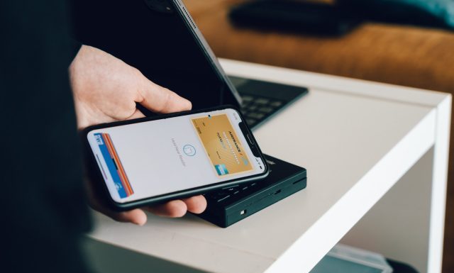 Things Bitcoin Can Buy person holding black android smartphone