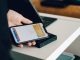 Things Bitcoin Can Buy person holding black android smartphone