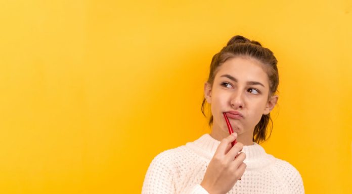 Do I Need A Cosmetic Dentist In Ontario? woman in white and black checkered dress shirt