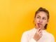 Do I Need A Cosmetic Dentist In Ontario? woman in white and black checkered dress shirt
